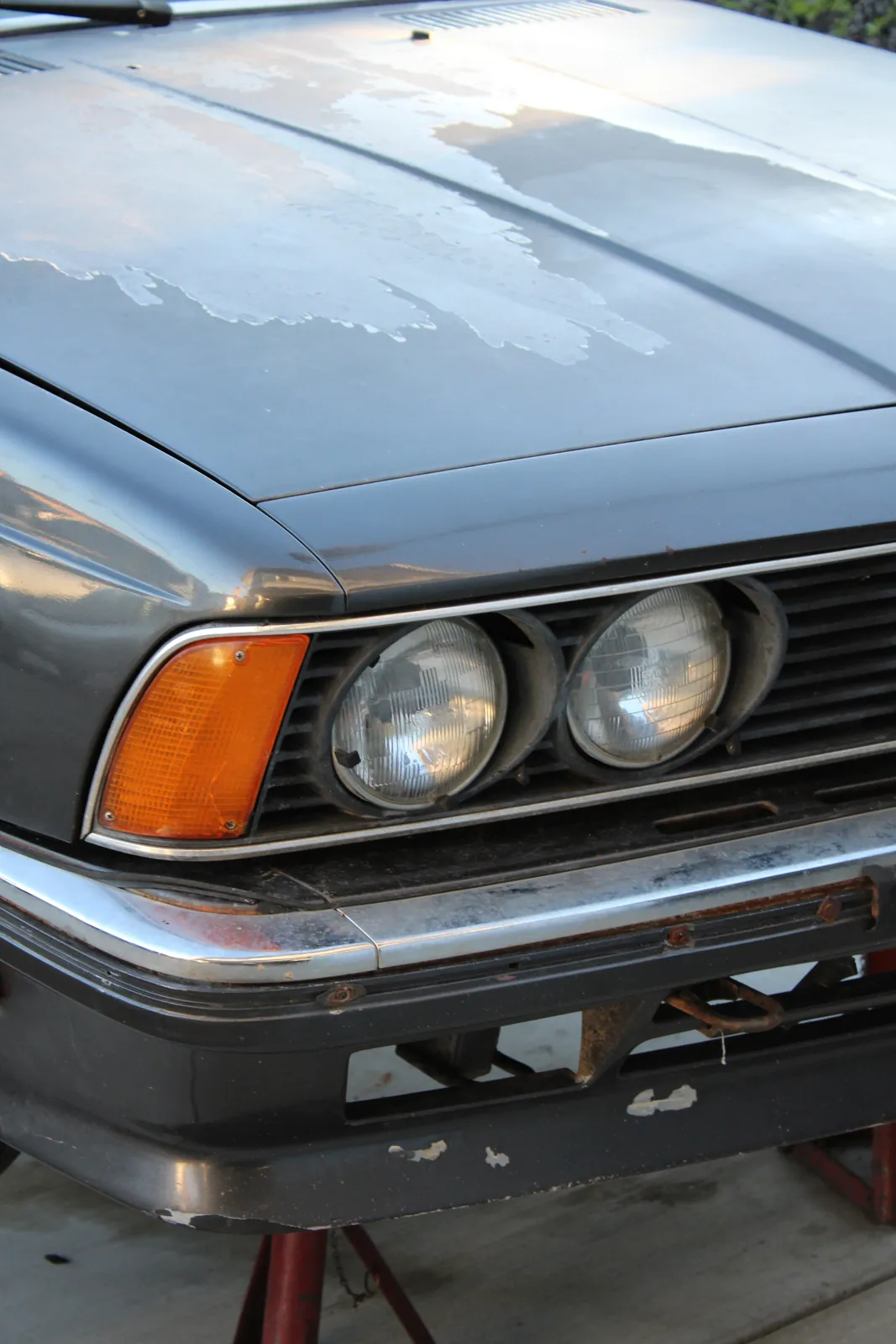 The front of Josiah’s 1982 BMW 635 CSi, headlights and hood